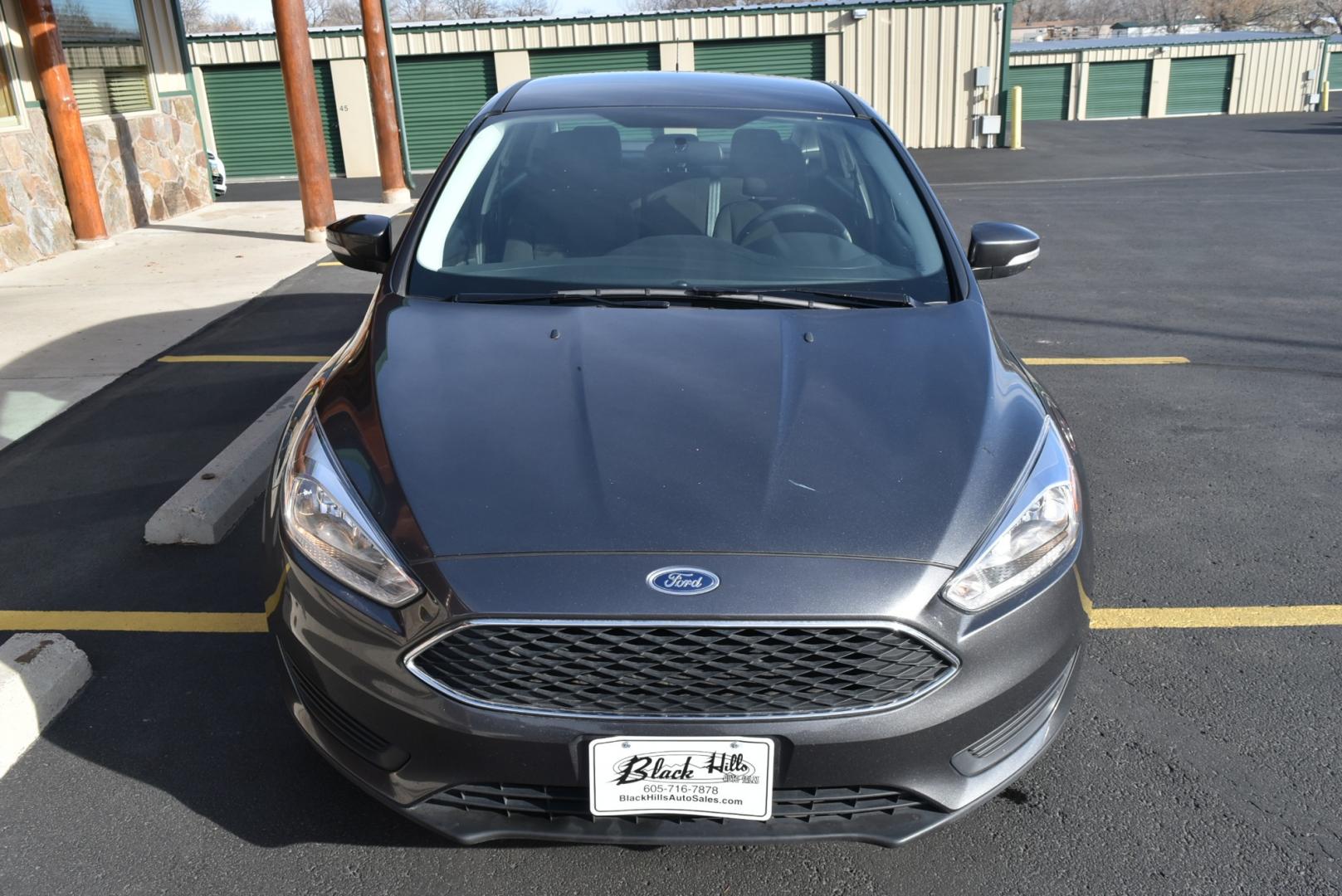 2016 Gray /Black Ford Focus SE (1FADP3F26GL) with an 2.0L I-4 GDI TI-VCT FLEX FUEL engine, 6-Speed Powershift Automatic transmission, located at 1600 E Hwy 44, Rapid City, SD, 57703, (605) 716-7878, 44.070232, -103.171410 - Photo#1